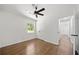 Bright bedroom with hardwood floors, ceiling fan, and large window at 2340 Cresta Dr, Decatur, GA 30032
