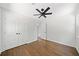 Neutral bedroom featuring hardwood floors, a ceiling fan, and a double-door closet at 2340 Cresta Dr, Decatur, GA 30032