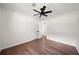 This bedroom has hardwood floors and a ceiling fan at 2340 Cresta Dr, Decatur, GA 30032