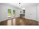 Bright dining area boasts hardwood floors, modern light fixture, and French doors leading to outdoor deck at 2340 Cresta Dr, Decatur, GA 30032
