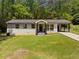 Charming single-story home featuring a carport and well-maintained front yard with ample green space at 2340 Cresta Dr, Decatur, GA 30032