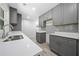 Modern kitchen featuring gray cabinets, white countertops, stainless steel appliances and wood look flooring at 2340 Cresta Dr, Decatur, GA 30032
