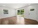 An empty living room with lots of light, beautiful hardwood floors, and freshly painted walls at 2340 Cresta Dr, Decatur, GA 30032