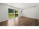 Bright, hardwood-floored living room with a sliding door to the backyard at 2340 Cresta Dr, Decatur, GA 30032