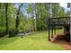 Spacious backyard with a cozy deck and a wooded area, perfect for outdoor enjoyment at 3717 Birchbriar Ct, Decatur, GA 30034