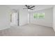 Neutral carpet in an airy room with a ceiling fan and window at 3717 Birchbriar Ct, Decatur, GA 30034