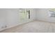 A well-lit bedroom features carpeted floors, neutral paint, and large windows offering great natural light at 3717 Birchbriar Ct, Decatur, GA 30034
