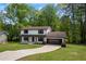 Beautiful two-story home with a well-manicured lawn and a long driveway at 3717 Birchbriar Ct, Decatur, GA 30034