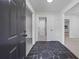 A view into the home from the front door, showing the slate flooring and neutral color palette at 3717 Birchbriar Ct, Decatur, GA 30034