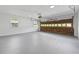 Spacious two-car garage featuring a clean epoxy floor, window, and door to the exterior at 3717 Birchbriar Ct, Decatur, GA 30034