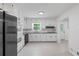 Recently updated kitchen with stainless appliances, white cabinetry, and eat-in dining area at 3717 Birchbriar Ct, Decatur, GA 30034