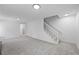 Bright living room features plush carpeting, a staircase, and contemporary recessed lighting throughout at 3717 Birchbriar Ct, Decatur, GA 30034