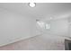 Spacious and bright living room features plush carpeting and a staircase to the upper level at 3717 Birchbriar Ct, Decatur, GA 30034