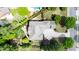 Aerial view showcases a well-maintained home with a spacious driveway and mature landscaping at 4231 Shamans Dr, Marietta, GA 30062