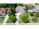 Aerial view showcases a home with a spacious yard, mature trees, and well-maintained landscaping at 4231 Shamans Dr, Marietta, GA 30062
