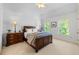 Inviting bedroom with natural light, featuring a comfortable bed, and side tables at 4231 Shamans Dr, Marietta, GA 30062