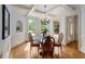 Elegant dining room with coffered ceilings, hardwood floors, and large windows at 4231 Shamans Dr, Marietta, GA 30062