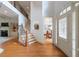 Inviting foyer featuring hardwood floors, a staircase, and views into the dining and living areas at 4231 Shamans Dr, Marietta, GA 30062