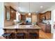Spacious kitchen features wood cabinets, granite counters, stainless appliances, and center island with seating at 4231 Shamans Dr, Marietta, GA 30062