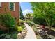 View of a lovely garden path with beautiful plantings adjacent to the brick home at 4231 Shamans Dr, Marietta, GA 30062