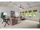 Bright living room featuring coffered ceilings, large windows, and comfortable seating at 4231 Shamans Dr, Marietta, GA 30062