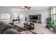 Spacious living room with a ceiling fan, large windows, and a comfortable leather sofa at 4231 Shamans Dr, Marietta, GA 30062