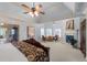 Expansive primary suite boasts a fireplace, seating area, and ensuite bathroom with walk-in shower at 4231 Shamans Dr, Marietta, GA 30062