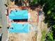 Aerial view of two homes under construction, showcasing lot size and proximity to surrounding areas at 11825 Serenbe Ln, Chattahoochee Hills, GA 30268