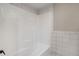 Clean bathroom with tiled tub and shower, perfect for relaxation at 122 Maison Nw Pl, Atlanta, GA 30327