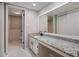 This bathroom showcases a spacious granite countertop vanity with black fixtures at 122 Maison Nw Pl, Atlanta, GA 30327