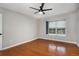 Charming bedroom with wood floors, window, and ceiling fan, creating a cozy atmosphere at 122 Maison Nw Pl, Atlanta, GA 30327