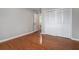 A bedroom featuring wood floors, with access to the closet and the bathroom at 122 Maison Nw Pl, Atlanta, GA 30327