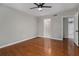 The bedroom features a ceiling fan and wood floors, offering a comfortable and stylish retreat at 122 Maison Nw Pl, Atlanta, GA 30327