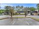 Exterior view of the condominiums surrounded by trees and a parking lot at 122 Maison Nw Pl, Atlanta, GA 30327
