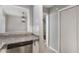Open kitchen view showcasing granite countertops, stainless steel appliances, and access to dining space at 122 Maison Nw Pl, Atlanta, GA 30327