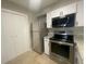 A bright kitchen with stainless steel appliances, granite counters and ample cabinet space at 122 Maison Nw Pl, Atlanta, GA 30327