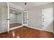 Living room with hardwood floors, french doors and a door leading outside at 122 Maison Nw Pl, Atlanta, GA 30327