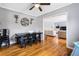 Dining room with hardwood floors, gray walls, and views into the living room at 1496 S Hairston Rd, Stone Mountain, GA 30088