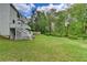 Well-maintained backyard with lush green lawn and a tiered deck at 2455 Kirkstone Dr, Buford, GA 30519