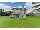 Expansive backyard with tiered deck, mature trees, and a lush green lawn at 2455 Kirkstone Dr, Buford, GA 30519