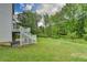 Expansive backyard view featuring lush lawn and a charming deck with stairs, perfect for outdoor entertaining at 2455 Kirkstone Dr, Buford, GA 30519