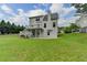 Spacious backyard with tiered deck, lush lawn, and privacy trees at 2455 Kirkstone Dr, Buford, GA 30519