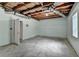 Unfinished basement with concrete floors, ductwork and access to the exterior at 2455 Kirkstone Dr, Buford, GA 30519