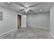 Unfinished basement with concrete floors, drop ceiling and recessed lights at 2455 Kirkstone Dr, Buford, GA 30519
