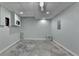 Unfinished basement with concrete floors, drop ceiling and recessed lights at 2455 Kirkstone Dr, Buford, GA 30519