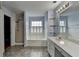Well-lit bathroom featuring a soaking tub, shower, and double sink vanity at 2455 Kirkstone Dr, Buford, GA 30519