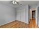 Cozy bedroom with hardwood floors, ceiling fan and a closet at 2455 Kirkstone Dr, Buford, GA 30519