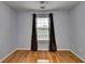 Bedroom featuring hardwood floors and a bright window view at 2455 Kirkstone Dr, Buford, GA 30519