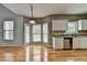 Bright breakfast nook and kitchen area with natural light, and granite countertops at 2455 Kirkstone Dr, Buford, GA 30519