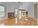 Bright living room with fireplace, hardwood floors, and an open floor plan at 2455 Kirkstone Dr, Buford, GA 30519